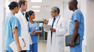 Doctors Teaching Soon-To-Be Physician in Hospital