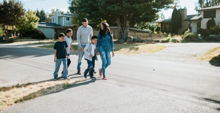 Family walks through a neighborhood