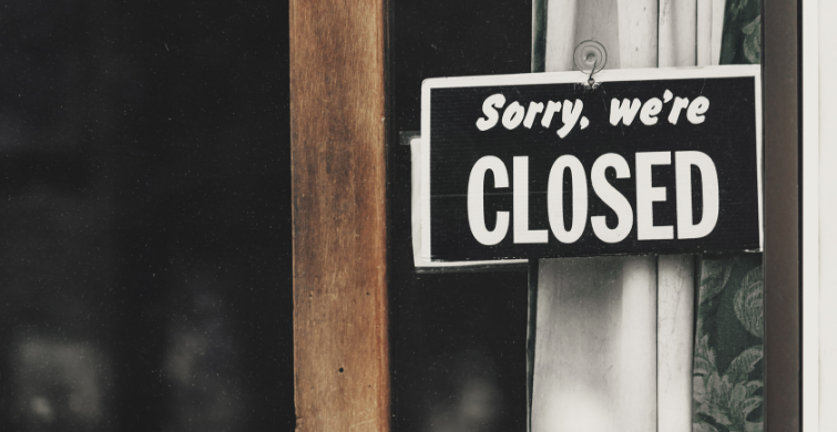 Sorry We're Closed Sign in Business Window