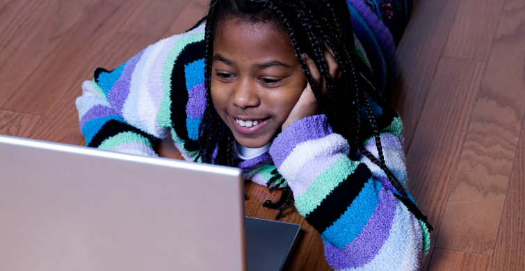 Girl looking at laptop