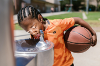 boy at water fountain